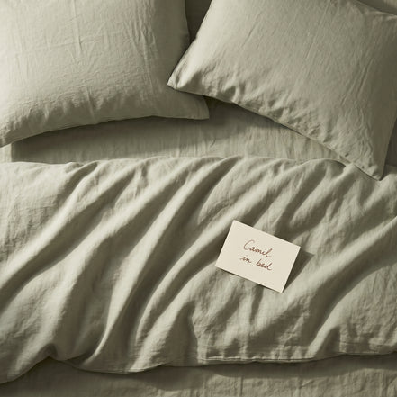 Soft sage green bed linen set seen from above