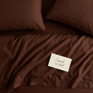 Deep brown bed linen set seen from above