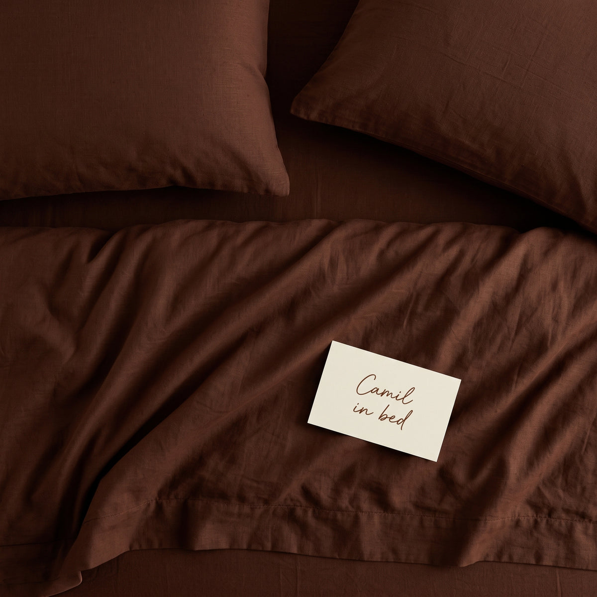Deep brown bed linen set seen from above