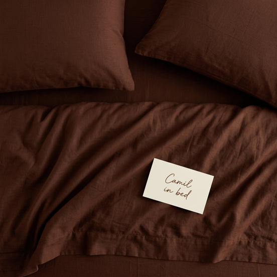 Deep brown bed linen set seen from above