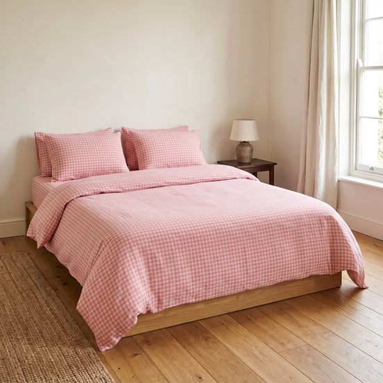 Double bed made up in the full dusty pink checked linen set