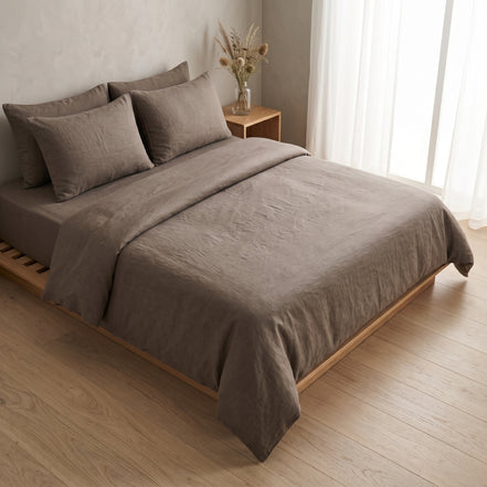 Double bed made up in the full warm taupe linen set