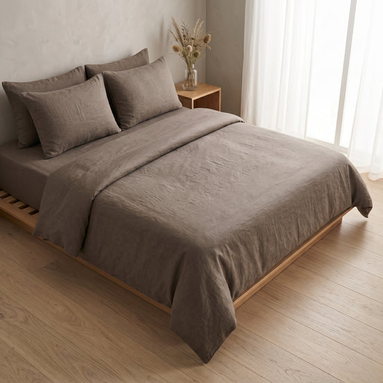 Double bed made up in the full warm taupe linen set