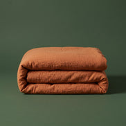 Rust linen folded into a neat block