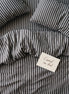 Deep charcoal striped bed linen set seen from above