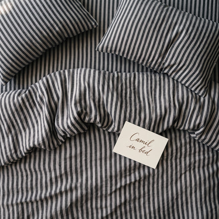 Deep charcoal striped bed linen set seen from above