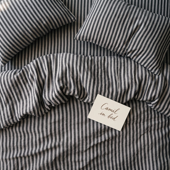 Deep charcoal striped bed linen set seen from above