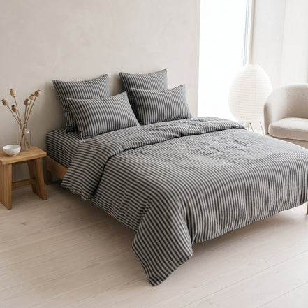 Double bed made up in the full charcoal striped linen set
