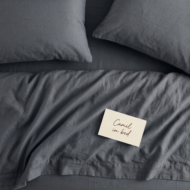 Deep slate grey bed linen set seen from above