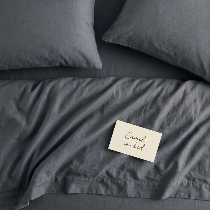 Deep slate grey bed linen set seen from above