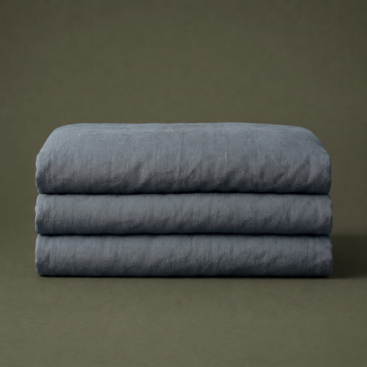 Slate grey linen folded into a neat block