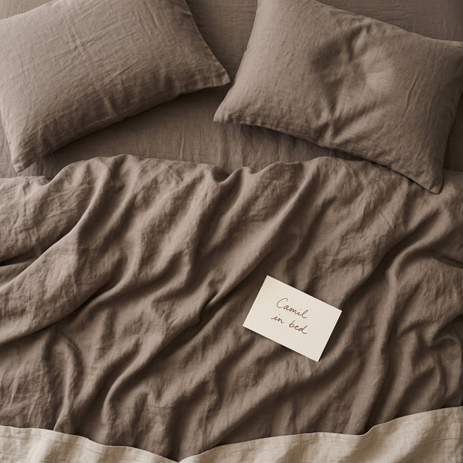 Warm taupe bed linen set seen from above