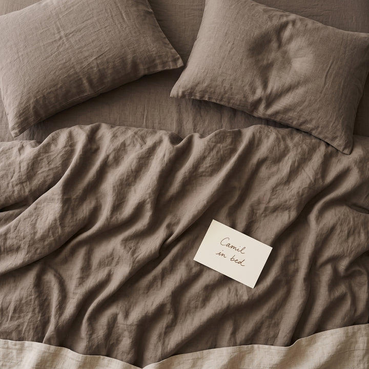 Warm taupe bed linen set seen from above