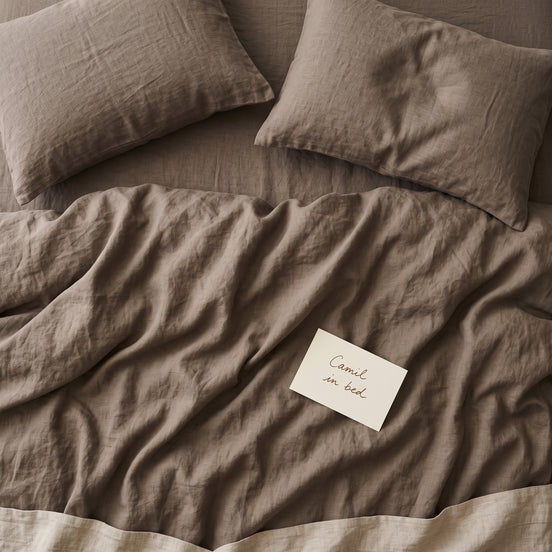 Warm taupe bed linen set seen from above